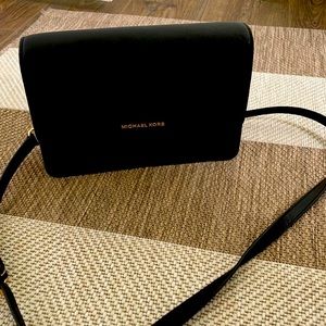 Black Michael Kors crossbody handbag in perfect condition.